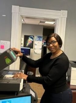 One employee of Delaware Corporate Headquarters makes copies in the Dover office.